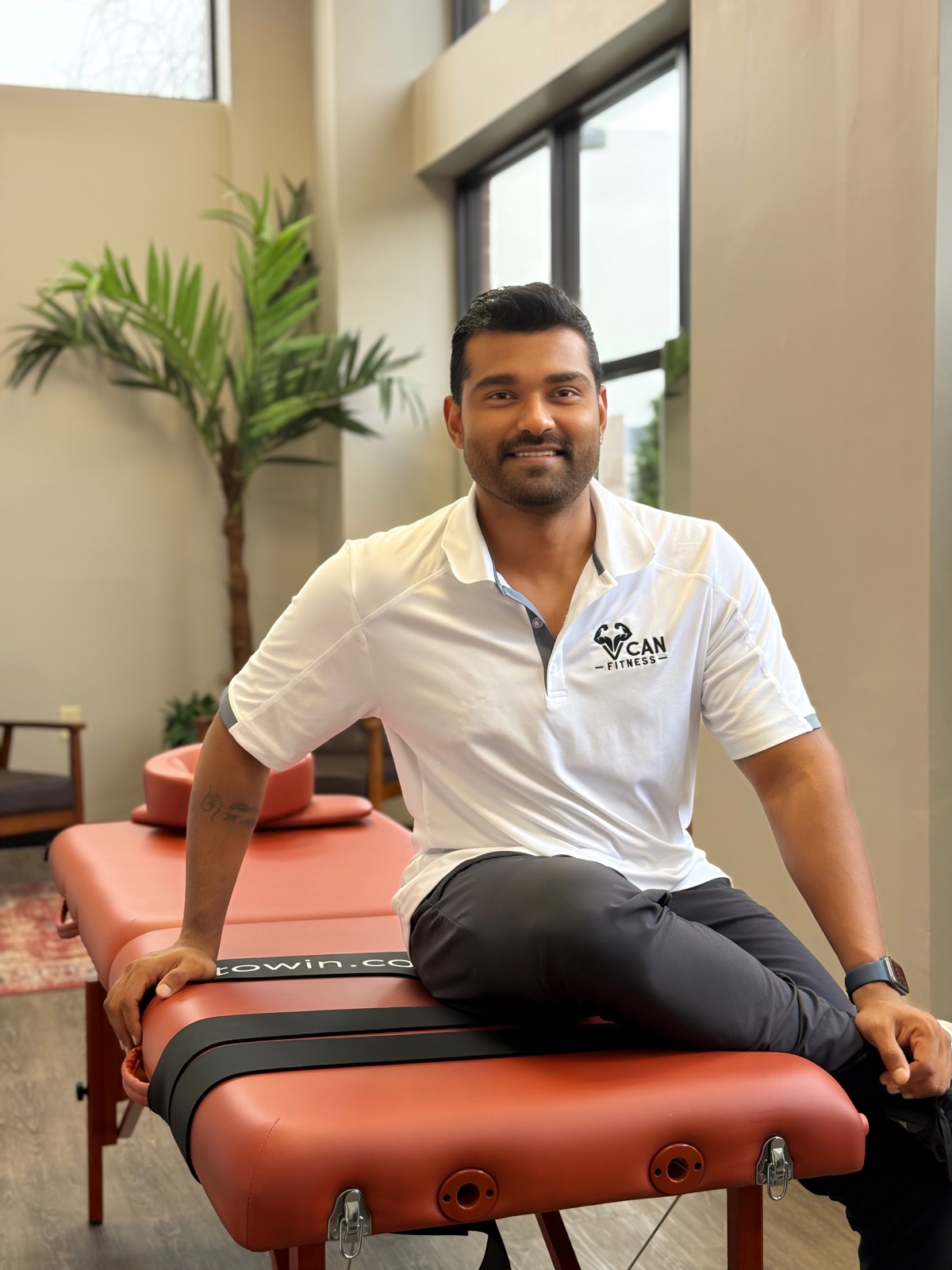 VCAN Fitness professional trainer with dumbbell in Nashville gym